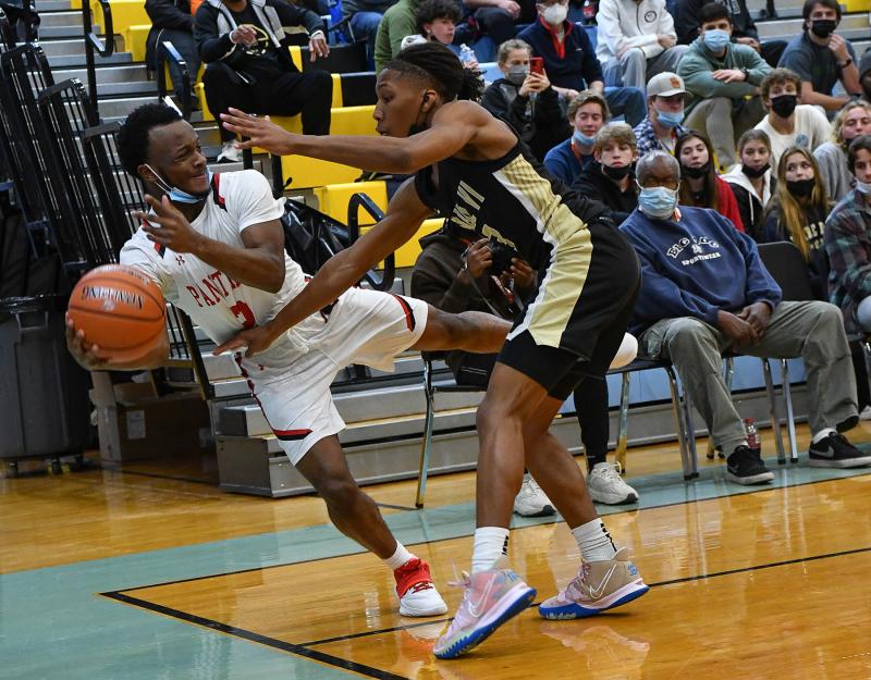 Imhotep’s Justin Edward saves a ball on the baseline.
