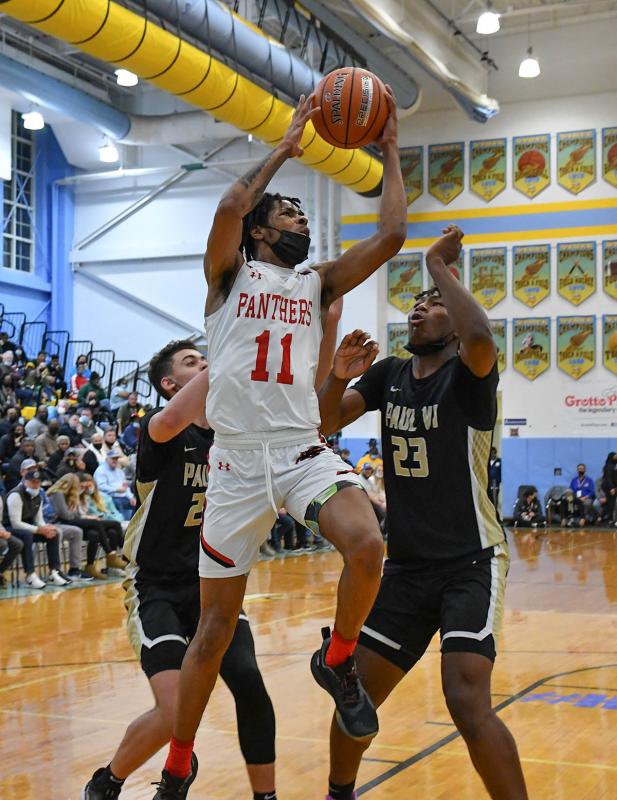 Imhotep’s Mo Abdullah goes strong to the basket.