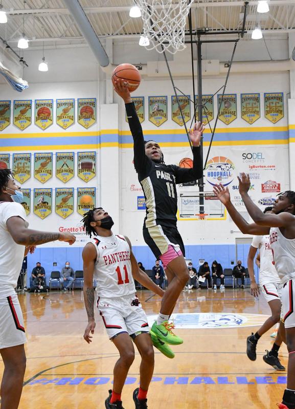 Paul VI guard Dug McDaniel glides to the hoop.