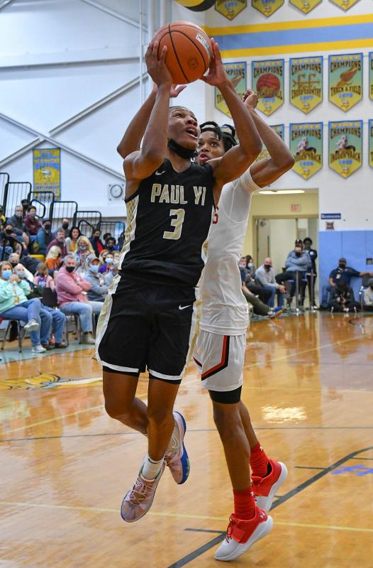 Paul VI guard Ben Hammond goes strong to the basket.