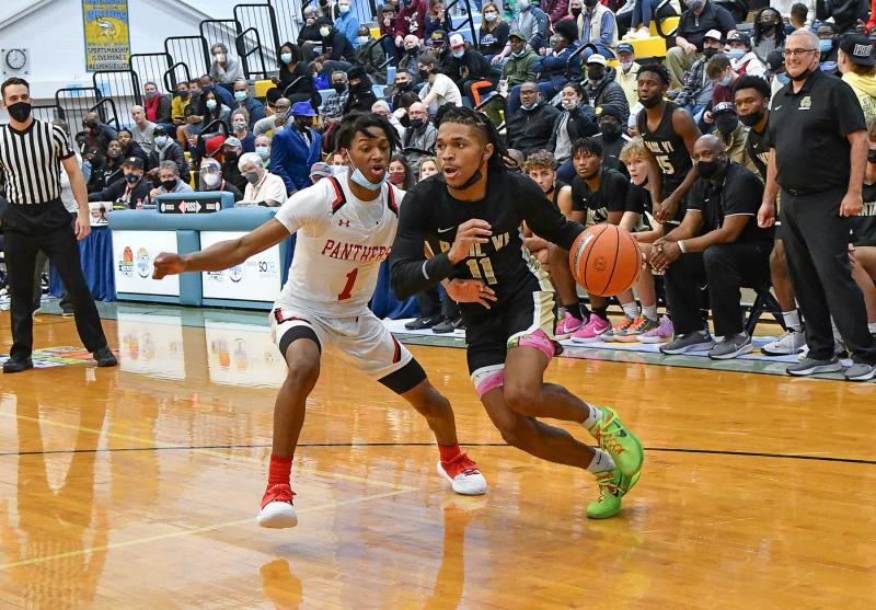 Paul VI guard Dug McDaniel drives baseline to the paint.
