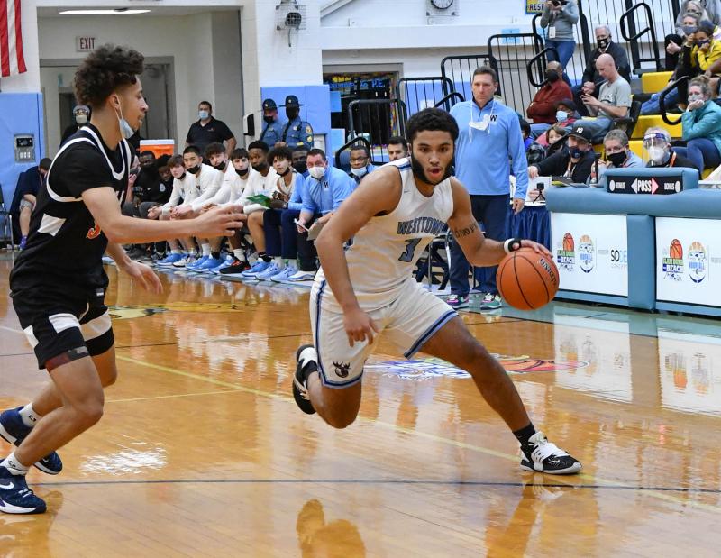 Westtown’s Quin Berger drives around NCA’s Isaiah Coleman.