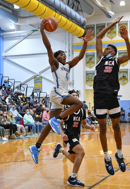Westtown’s Seyphon Triplett flies in for a dunk.