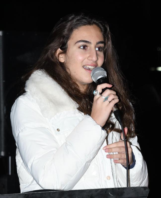 Sara Freih of Taylor Music Studios sings “Ava Maria” to start the Lewes Christmas tree-lighting ceremony and sing-along in Zwaanendael Park.