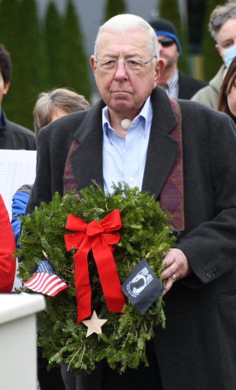 Fred Smith prepares to place a wreath in memory of fallen POWs and military members missing in action.
