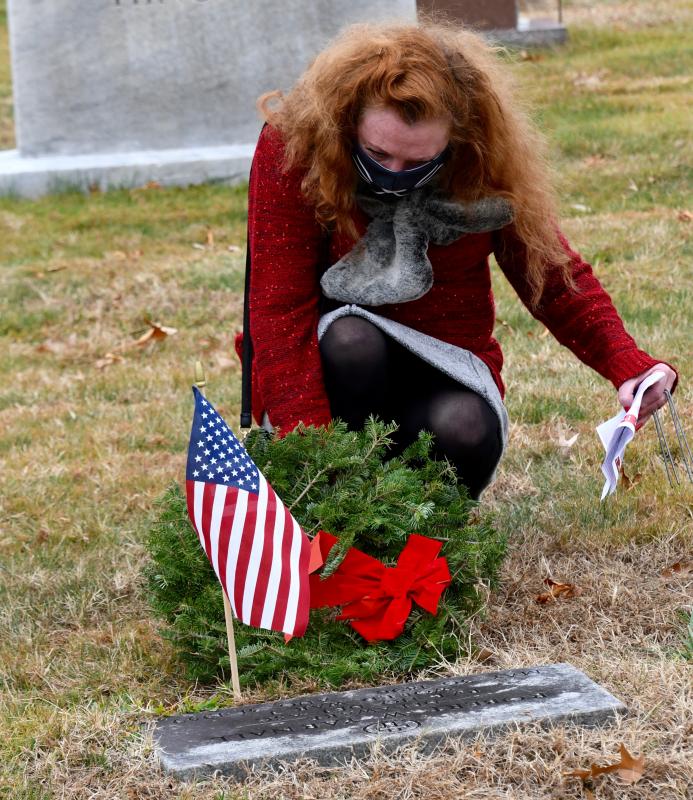 Kimberlee Kelly of Rehoboth Beach is one of nearly 100 volunteers who placed wreaths on the graves of veterans buried in Epworth Cemetery.