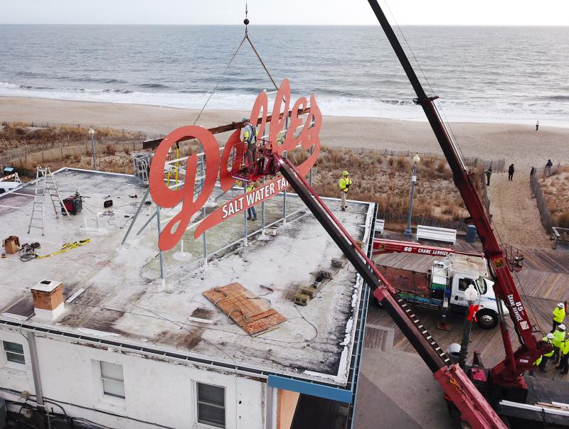 The crew from Rogers Sign Company is hard at work removing the sign. Crew members for the historic event included owner and crane operator Lynn Rogers, job supervisor Kenny W. Terhune, bucket truck crew leader Allen Jackson, crew member Ty Brown, ground rigger Keith "Julio" Revelle, crew leader Wil Heuring, crew leader and crane operator Larry Holding, job safety officer Diane Terhune, and public information officer June Aydelotte.
NICK ROTH PHOTO