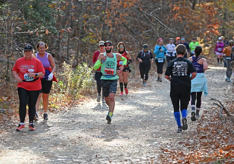 The half-marathon crowd parts to let marathon runner-up Woody Snoberger run through. NICK ROTH PHOTO