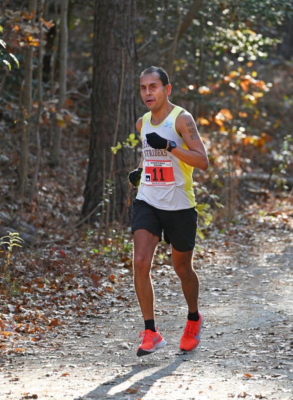 Local runner Martin Rodriguez powers his way along the Junction & Breakwater Trail. Rodriguez would finish seventh overall. NICK ROTH PHOTO