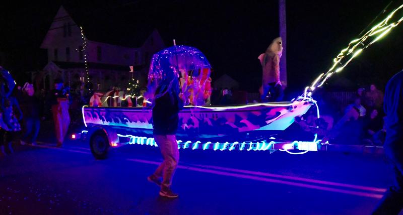 The third-place University of Delaware Marine Studies Campus float lights up the parade route along Savannah Road with a host of sea creatures.