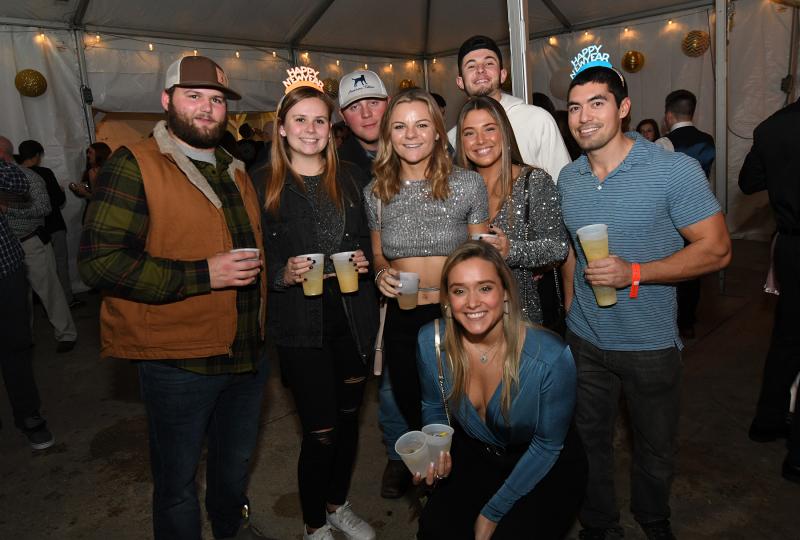 Having a blast at the Bottle & Cork are (l-r) Liam Zolper, Emma Hiett, Jackson Ostroski, Payton Welch, Taylor Smith, Dane Palmer, and Steve Hagan. In front is Sydney Kirsh.