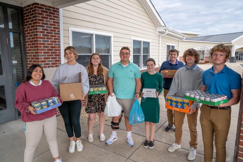 Delmarva Christian High School National Honor Society students promoted the food drive, packed the items, and helped deliver them to The Circle in Georgetown. Shown are (l-r) Sarah Gardner, Ayla Basar, Isabelle Donihue, Brooks Parker, Briana Reigle-Fabber, Henry Grote, Dillon Koster and Evan Murray. SUBMITTED PHOTOS