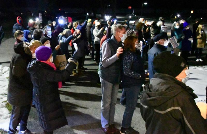 People attending the Jan. 6 vigil listen to speeches urging them to get others involved in the fight to strengthen the nation’s democracy.