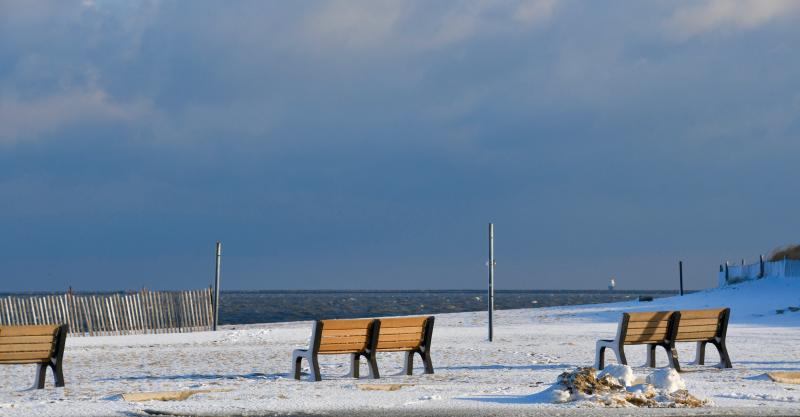 With snow on the ground and ominous clouds in the background, it’s not a good day to visit Lewes Beach. RON MACARTHUR PHOTO