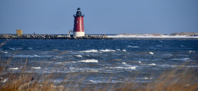 Winter has arrived – there is no doubt about it. A brisk wind whips up waves in Delaware Bay near the Delaware Breakwater East End Lighthouse with snow-covered dunes in the background. RON MACARTHUR PHOTO