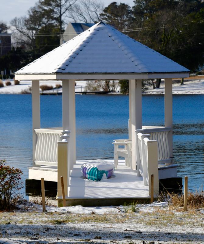 One of the iconic white gazebo docks on Rehoboth’s Silver Lake is covered in a thin layer of snow from a Jan. 22 storm.