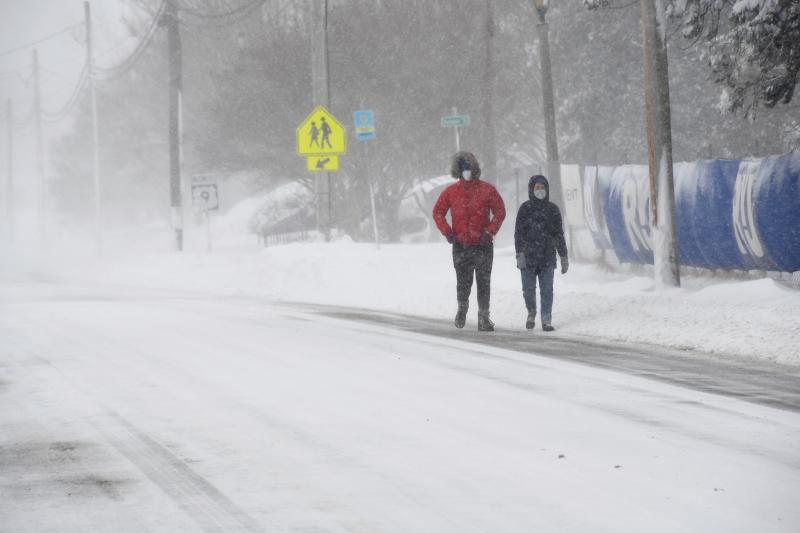 This couple ventures out to brave the elements as they walk along Savannah Road, Lewes. RON MACARTHUR PHOTO