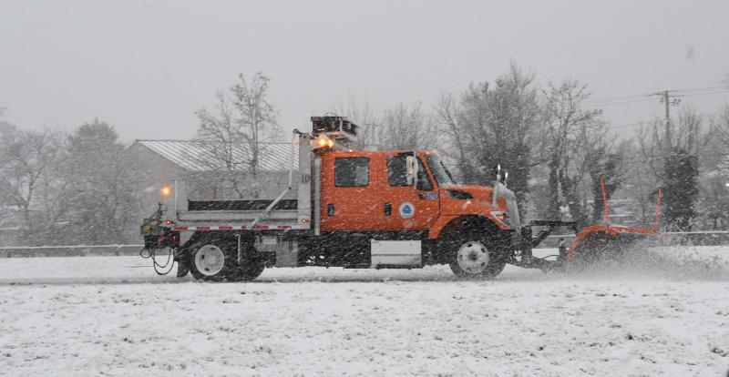 A DelDOT plow moves snow off Route 1 near the Nassau Bridge early Monday morning. RON MACARTHUR PHOTO