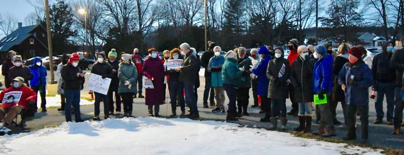 Vigil attendees gather around the circle in front of the Unitarian Universalists of Southern Delaware church.