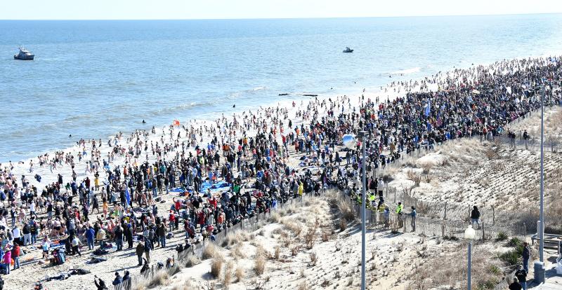 Thousands of people plunge into the Atlantic Ocean. This is the view from atop the Atlantic Sands Hotel. DAN COOK PHOTO