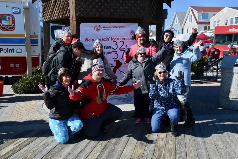 The Carol Bak Beach Beauties pose for the traditional photograph in front of the Polar Bear Plunge temperature sign on the Boardwalk. RON MACARTHUR PHOTO