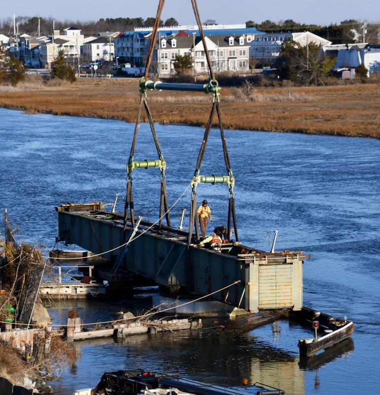 Just after sunrise on Feb. 15, workers return to the swing-bridge site to prepare for its lift and move.