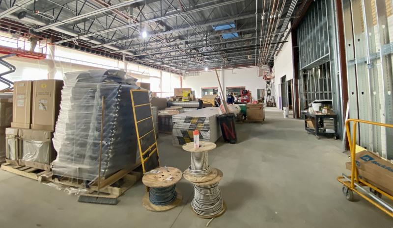 The cafeteria is full of boxed furniture and building supplies now, but it will soon house hundreds of hungry students.
