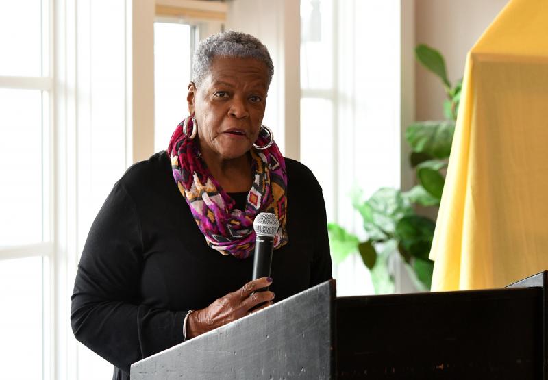 Waynne Paskins of the Community Celebration Committee reads a poem titled “Reverend George H. Edwards Sr.” by Esther Thomas.