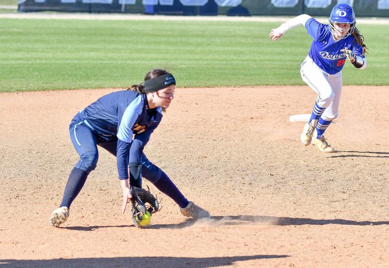 Cape freshman shortstop Milena Buehler scoops up a Dover grounder.