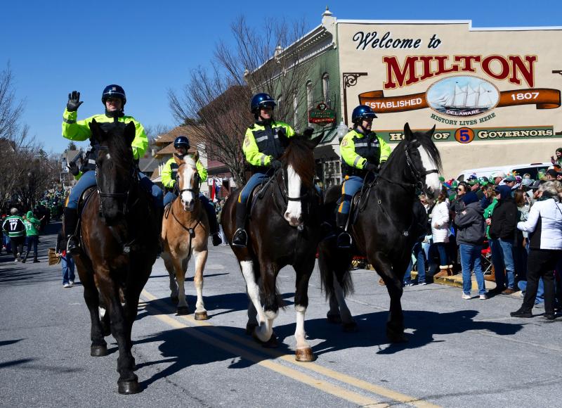 With the welcome to Milton sign in the background, the Delaware State Police Mounted Patrol Unit takes part in the parade.