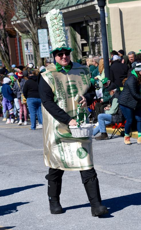 Jack Riddle, Community Bank Delaware president, walks the parade route handing out candy and even a few $1 bills.