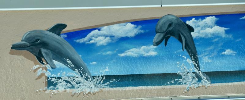 A mural painted by Bret Steeves lines a wall outside the third floor of the facility. Local artwork and photography will eventually line the halls and rooms of the new hospital.