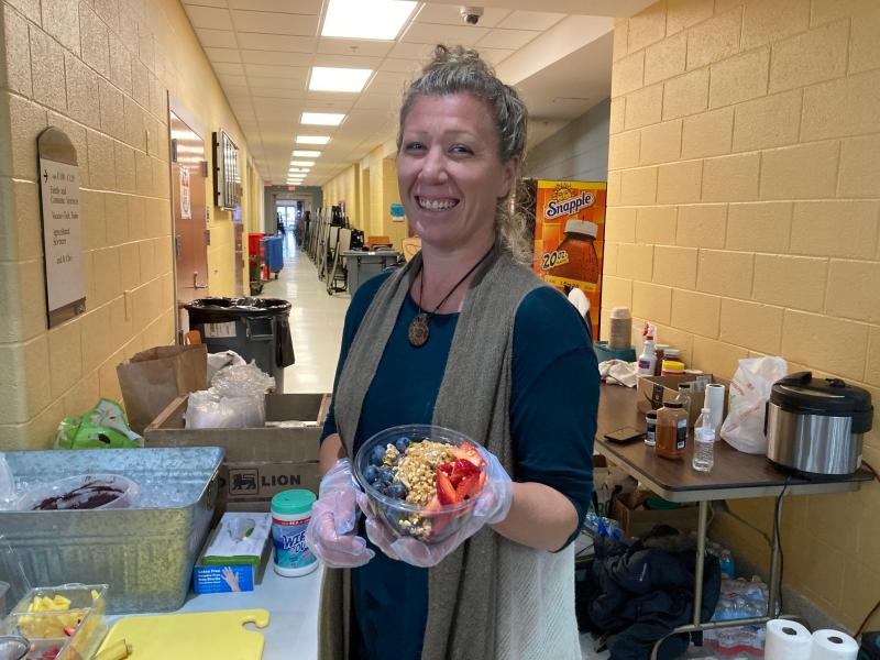 Chelsea Mahon of Bountiful Bowls serves up an acai bowl with strawberries, blueberries and granola.