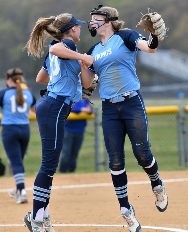Cape freshmen Bri Windish, left, and Ava Calciano celebrate a great play in the infield.