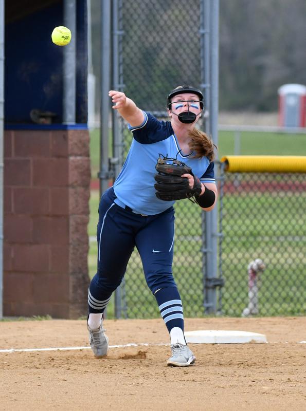 Freshman Alivia Heers makes a throw for an out from her third-base position.