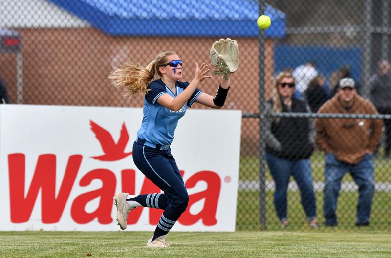 Cape center fielder Kenna Justice runs down and squeezes a Central fly ball.