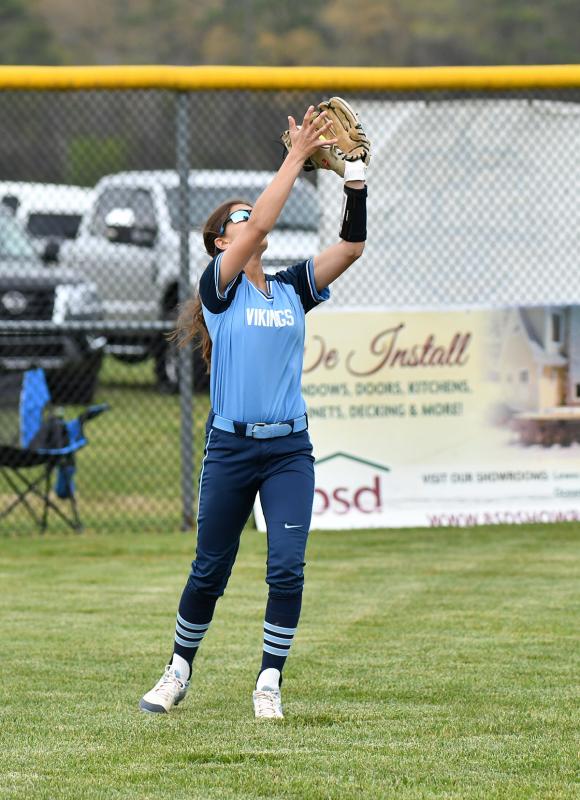 Sophomore Ava Simeone snags a fly ball for a putout in left.