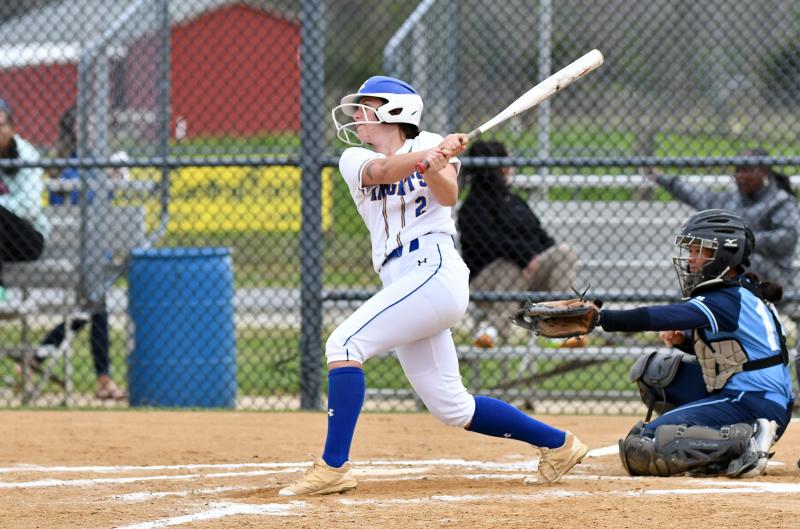 Junior McKenna Boyle hits a single for the Knights.