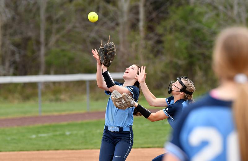 Freshman shortstop Milena Buehler snags a pop-up with Ava Calciano ready to assist.