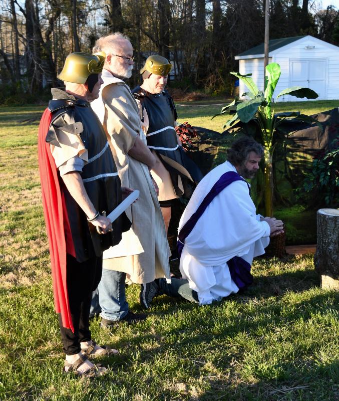 Jesus, portrayed by Dave Rhoten, is betrayed by Judas (Steve Grahovac) and led away by Roman soldiers Rich Stout and John Hoffman.