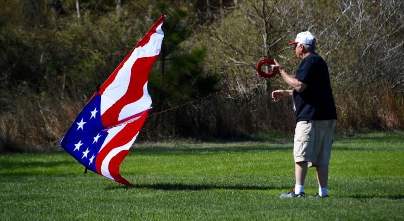 Veteran kite flyer Bill Goodwin of Ocean View displays his favorite colors with his red, white and blue kite.