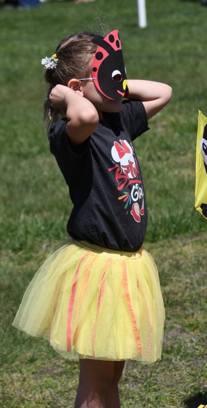 Novalee Coleman of Bel Air, Md., dresses as a ladybug as she prepares to fly her kite in the children’s competition.