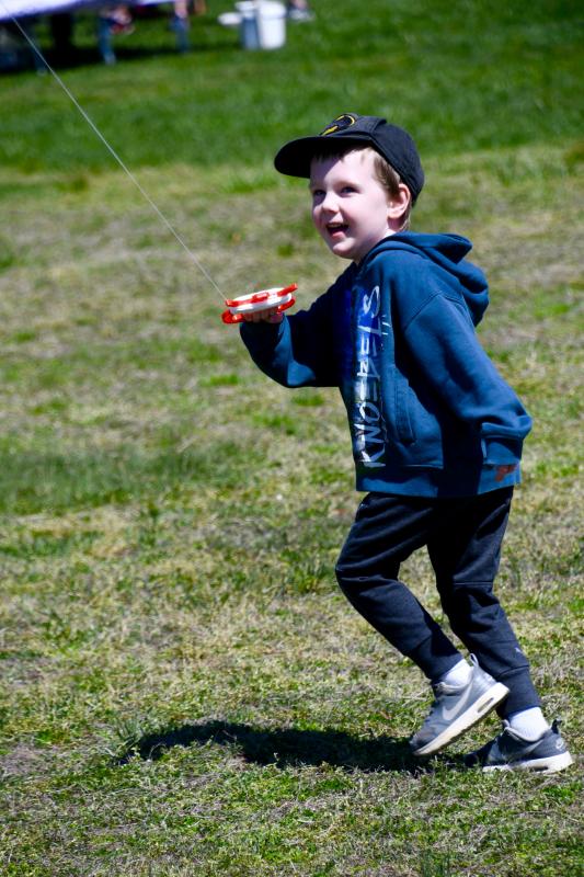 Bruce Lester, 4, one of the day’s youngest competitors, gets his Batman kite aloft during competition.