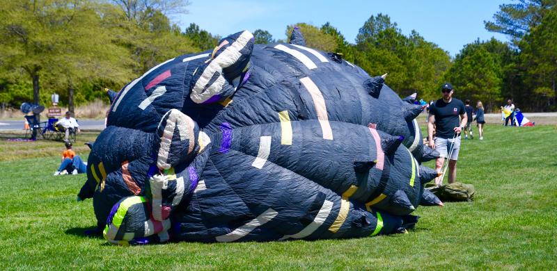 Patrick Callahan of Wilmington has the largest kite by far. There wasn’t enough wind for him to get the kite aloft, although he flew many others throughout the day.