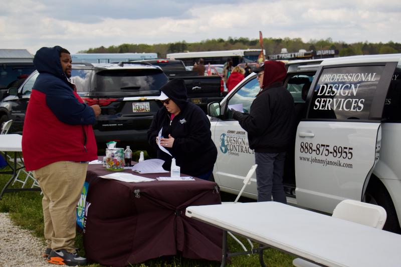 Laurel resident Raymare Horsey speaks Johnny Janosik’s HR Manager Heather Porter. Horsey was seen at almost every vendor.
