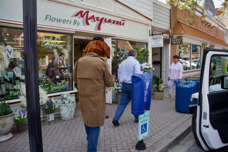 Making the right choice for the community, McGruff, Chief Spell, and Lewes Police Foundation’s Daniel DeSimone help load the flowers to resolve the issue.