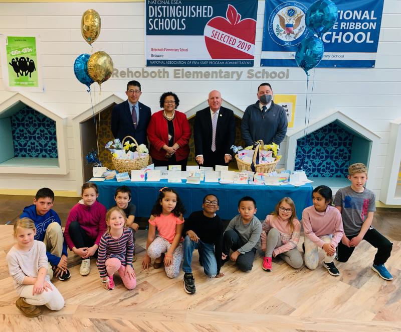 Rehoboth Elementary students representing each grade greeted the Beebe officials. Shown in back are (l-r) Beebe Healthcare President and CEO Dr. David Tam, Rehoboth Elementary Principal Dr. Doris Person, Beebe Medical Foundation President Tom Protack and Assistant Principal Kevin Monaghan. Student grade representatives in front are Kinsley Emmert, second grade; Jack Willmot, fifth grade; Avery Isaac, fifth grade; Ariana Fruchtman, kindergarten; Everett Isaac, third grade; Maria Ferreira, kindergarten; Elijah Cain, fourth grade; Archie Nguyen, first grade; Virginia Lamb, third grade; Anya Murukutla, second grade; and AJ Stevens, fifth grade. SUBMITTED PHOTOS