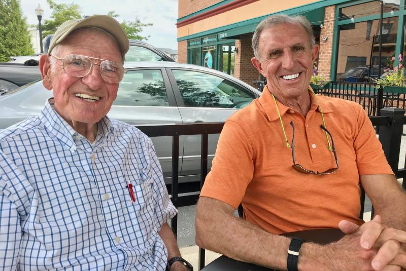 Joe Hudson, left, and Joe Schell share an outside table at Arena’s in Lewes in 2018. DENNIS FORNEY PHOTO