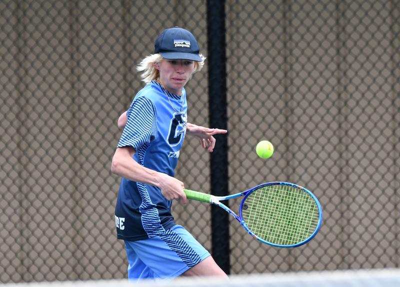 Cape junior John Southerst hits a backhand service return in the 6-2, 6-4 win over Naman Bhavsar of Dover.
