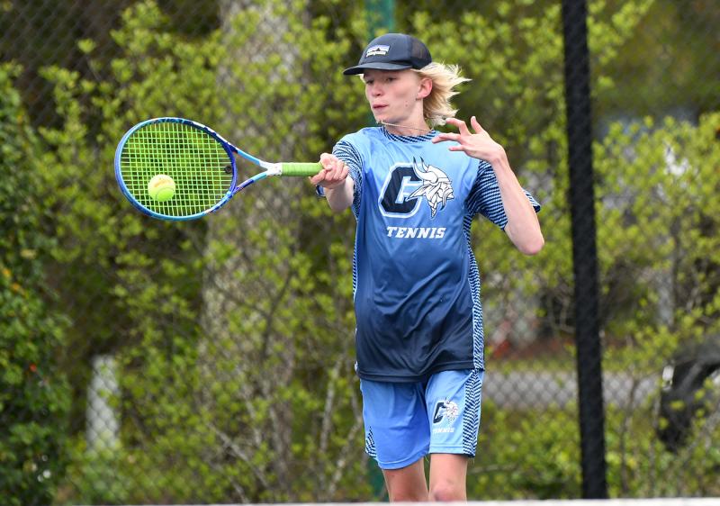 Cape junior John Southerst smacks a forehand drive in his 6-2, 6-4 victory over Naman Bhavsar of Dover.